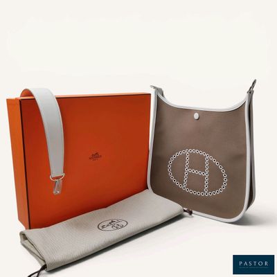 an orange and grey bag with a peace sign on it