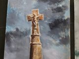 four paintings of a cross on a table with a sky background