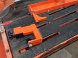 someone is using a circular saw to cut a piece of wood