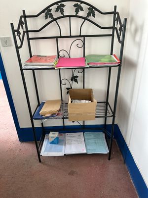 a shelf that has a bunch of books on it