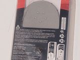 packaging of a circular sanding disc in a package on a white surface