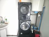 a washer and dryer in a small room