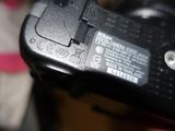a close up picture of a camera with a battery