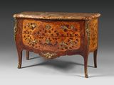 an antique chest of drawers with a marble top