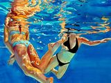 painting of two women in bikinis swimming in a pool