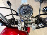 a close up of a motorcycle with a speedometer on the handlebars