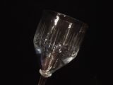 a wine glass that is sitting on a table