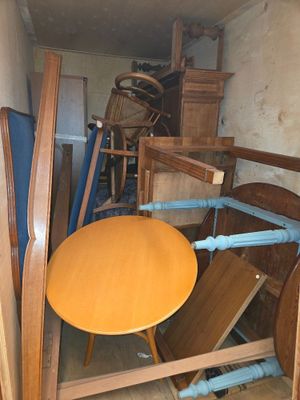 a table and chairs in a room with a lot of furniture