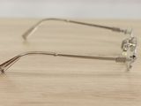 a pair of glasses sitting on a wooden table