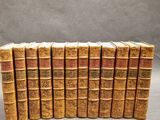 a stack of old books sitting on top of each other