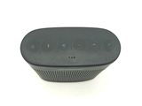an image of a black speaker sitting on top of a white surface