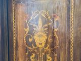 an image of a wooden cabinet with a floral design on it