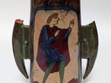a vase with a picture of a man on it