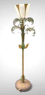 a lamp that is on a stand with a plant on it