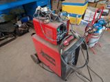 a welding machine that is sitting in the garage