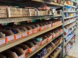 many shelves in the store with various items on them
