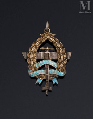 a close up of a medal with a cross on it