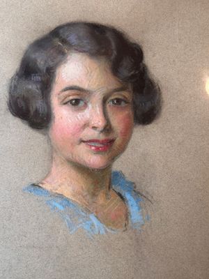 portrait of a woman in a blue dress with a white background