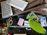 a box full of assorted items that are sitting on the floor