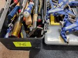 many different tools in a case on the floor