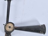a small black object on a white surface