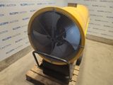 an industrial fan sitting on a pallet in front of a wall