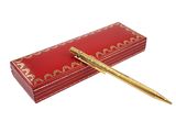 an image of a pen sitting on top of a red box