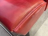 an image of a red leather chair with a metal frame