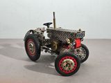a model of a tractor made out of metal