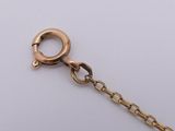 an image of a close up of a chain with a ring on it