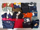 a lot of clothes that are on a table