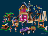 a toy set of a farm with a tractor and a horse