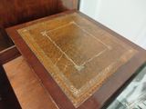 a wooden table with a glass top on a wooden table