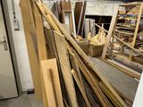 many pieces of wood that are stacked up in a room