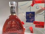 a bottle of wine that is sitting next to a box