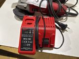 a red corded drill and a red corded corded drill on a table
