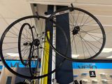 two bikes that are hanging from the ceiling in the store