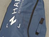 a bag that is sitting on the ground with a logo on it