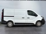 the white van is parked in the garage with its door open