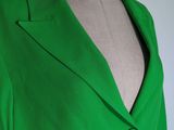the back view of a green jacket on a mannequin mannequin mannequin mannequin mannequin mannequin mannequin manne