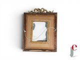 a picture of a mirror hanging on the wall