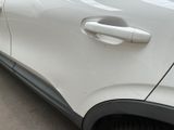 a close up of a car door handle on the side of the car