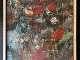 abstract painting of red, blue, green, and black on a black background