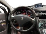 the interior of a car with a steering wheel and dashboard controls