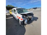 a white van that is sitting in the middle of a parking lot