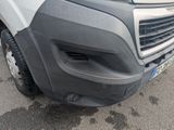 a close up of the front bumper of a van