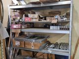 a metal shelf with many boxes on top of it
