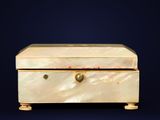 a white box with a gold handle on a blue background