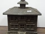 a small statue of a building with a steeple on top