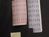two playing cards are sitting next to each other on a table